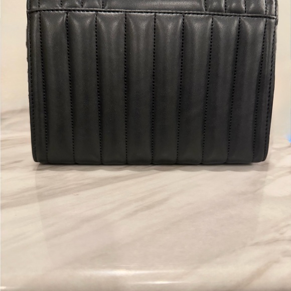 Michael Kors Black Quilted Crossbody Bag with Gold Accents
New with Tags - Picture 2 of 4